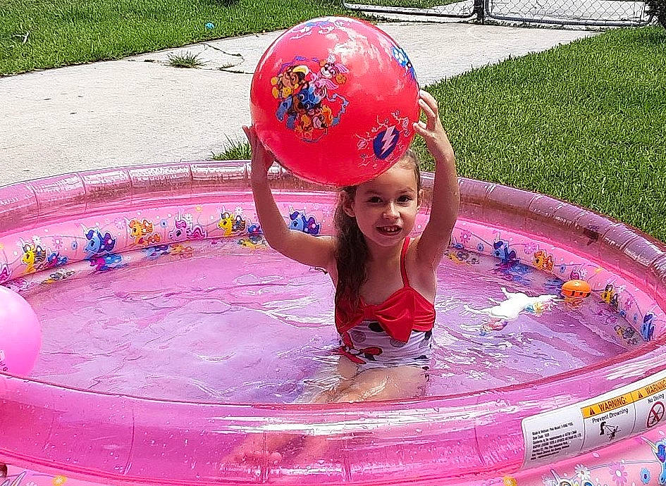 Aiyana joined the competition — help win amazing prizes! baby_float, bathing, child, fun, green, headwear, inflatable, joy, leisure, magenta, outdoor_recreation, person, personal_protective_equipment, pink, play, product, recreation, red, smile, summer
