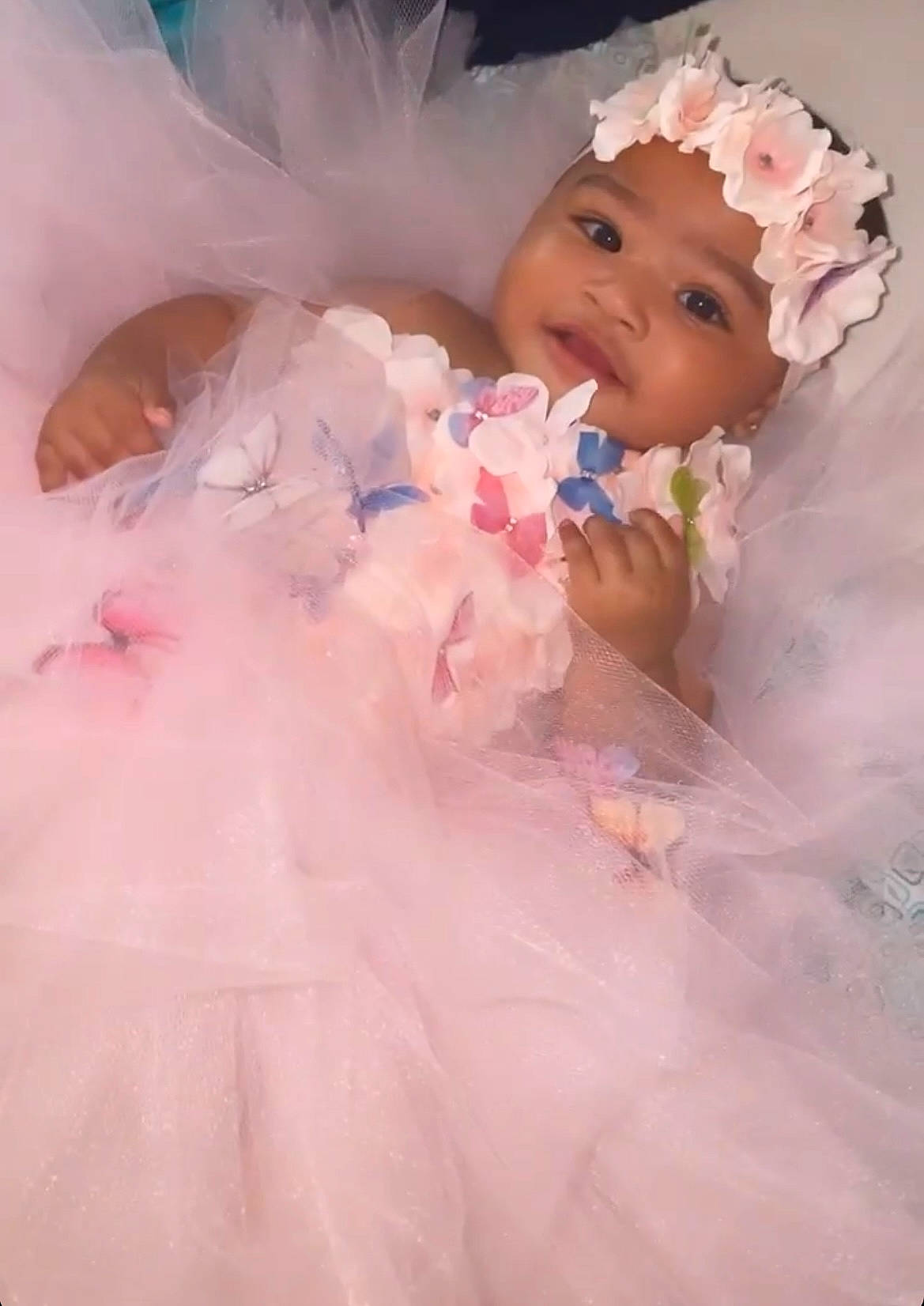 Amberlise is registered to the contest to win money with this photo: baby, baby_toddler_clothing, beauty, bridal_accessory, bridal_clothing, dress, embellishment, eyebrow, flower, hairstyle, happy, head, headgear, headpiece, headwear, iris, lip, person, petal, pink