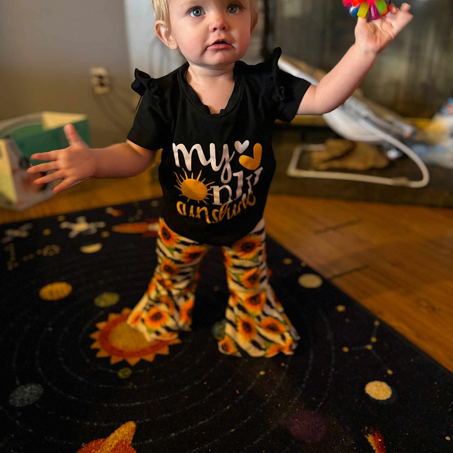 Itzayana is registered to the contest to win money with this photo: bodypart, box, boy, child, clothing, face, finger, flower, hand, hardwood, head, male, pants, person, photography, plant, portrait, t_shirt, toy, wood