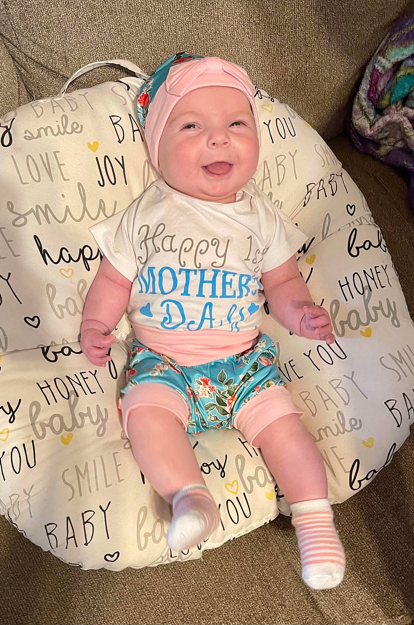 Hadley is registered to the contest to win money with this photo: baby, baby_toddler_clothing, cap, cheek, child, cool, eye, facial_expression, finger, happy, head, headwear, organ, person, pink, skin, sleeve, smile, t_shirt, textile