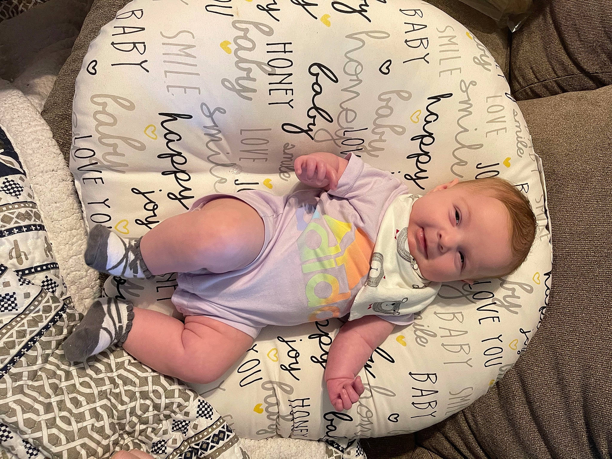 Hadley is registered to the contest to win money with this photo: abdomen, baby, baby_sleeping, baby_toddler_clothing, bedding, bedtime, chest, child, comfort, finger, font, headgear, knee, linens, nap, pattern, person, stomach, textile, thigh