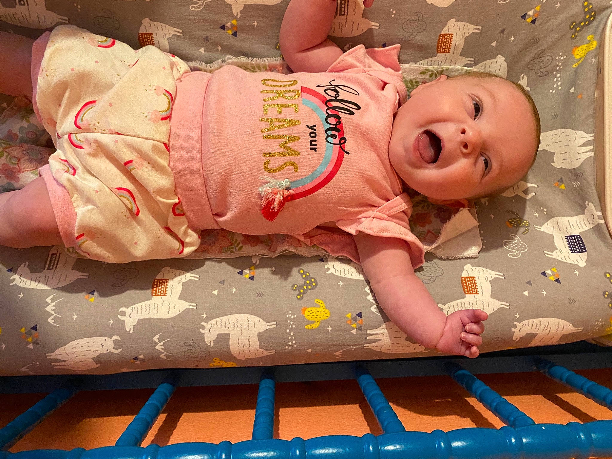 Hadley is registered to the contest to win money with this photo: baby, baby_products, baby_safety, baby_sleeping, baby_toddler_clothing, cheek, child, comfort, flooring, fun, happy, linens, pattern, person, pink, room, skin, sleeve, smile, textile