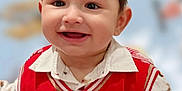 Daniyal joined the competition — help win amazing prizes! applique, baby, babylaughing, bodypart, clothing, coat, face, finger, hand, happy, head, knitwear, pants, pattern, person, photography, portrait, shirt, smile, sweater