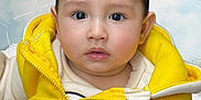 Daniyal is registered to the contest to win money with this photo: baby, blackhair, clothing, coat, face, happy, head, hood, hoodie, jacket, knitwear, lifejacket, pants, person, photography, portrait, smile, sweater, sweatshirt, vest