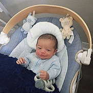 Destin joined the competition — help win amazing prizes! baby, infant, blue_clothing, baby_seat, plush_toy, pacifier, blanket, indoor, smile, face, head, hand, cushion, toy, person, newborn, baby_boy, comfort, nap_time, child
