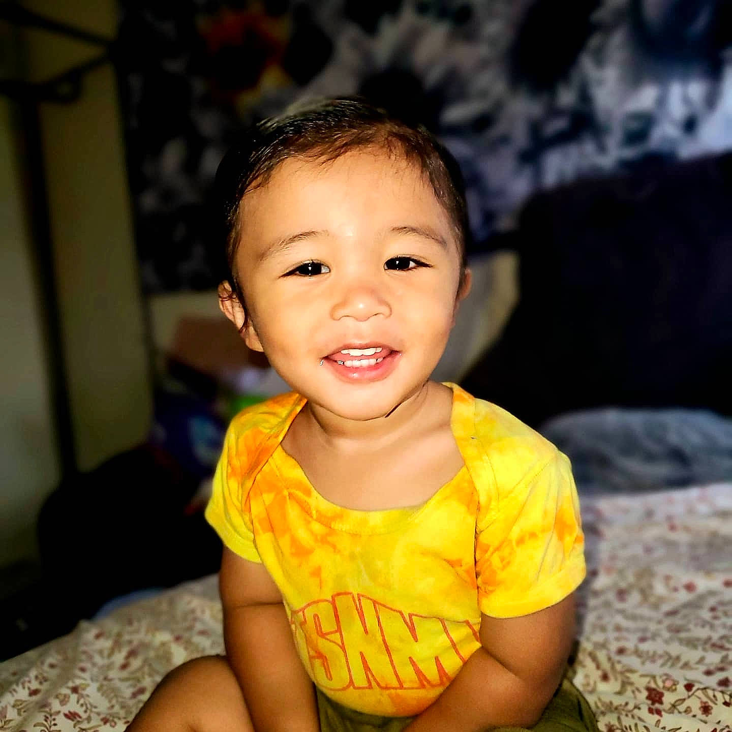Kainoa joined the competition — help win amazing prizes! baby, baby_laughing, baby_toddler_clothing, cheek, child, ear, eye, face, facial_expression, flash_photography, happy, iris, joy, laugh, mouth, nightwear, nose, person, sitting, skin