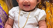 Tithya is registered to the contest to win money with this photo: accessories, baby, babylaughing, blouse, bodypart, child, clothing, dress, face, female, finger, girl, happy, head, jewelry, necklace, person, photography, portrait, smile