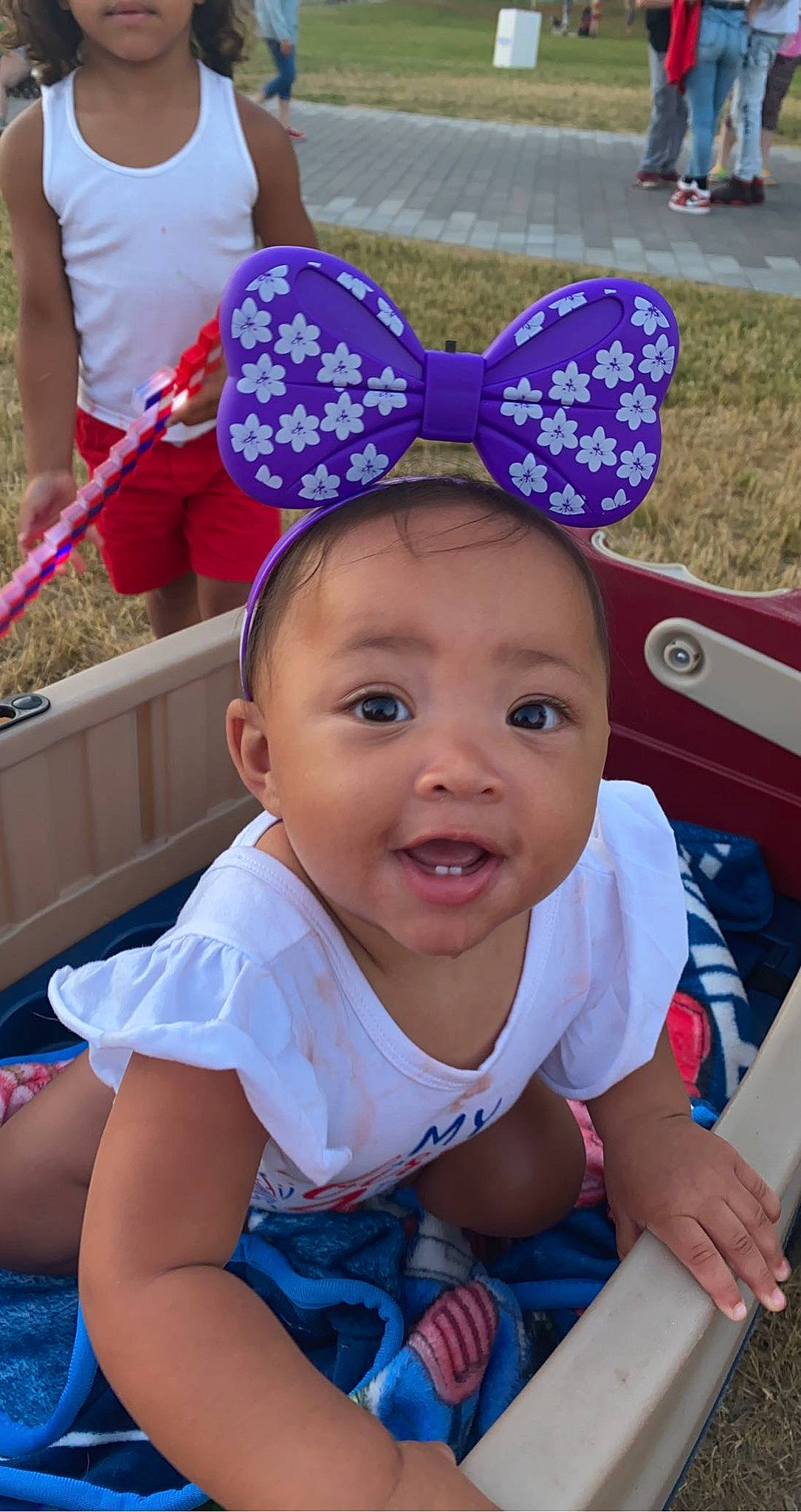 Zariyah joined the competition — help win amazing prizes! baby, baby_toddler_clothing, blue, blurred, cap, cheek, child, facial_expression, fun, grass, green, happy, leisure, light, people, person, pink, purple, skin, smile
