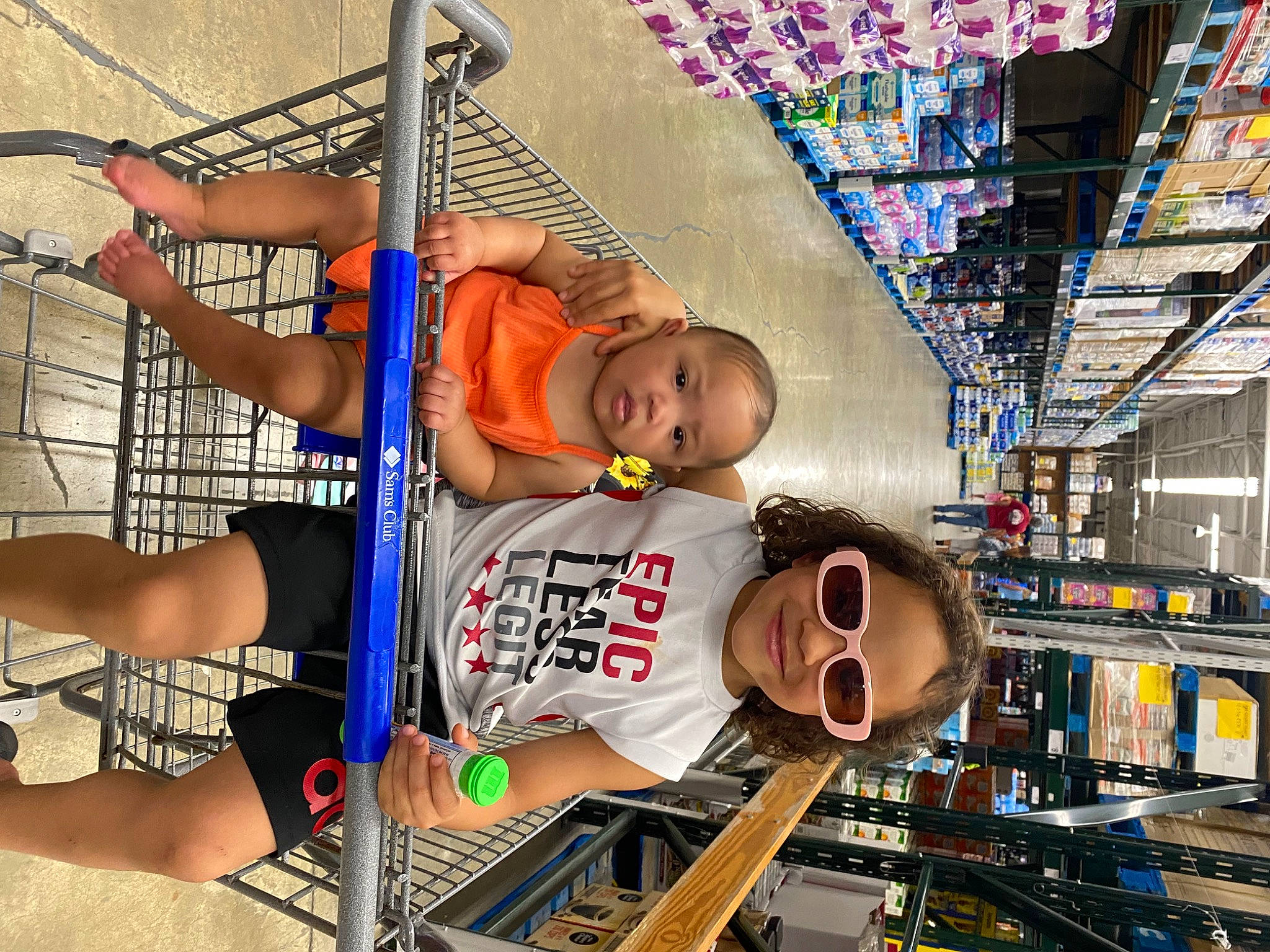 Zariyah is registered to the contest to win money with this photo: aerospace_engineering, ceiling, child, city, engineering, fun, hat, joy, leisure, machine, net, person, physical_fitness, recreation, retail, room, shorts, t_shirt, toddler