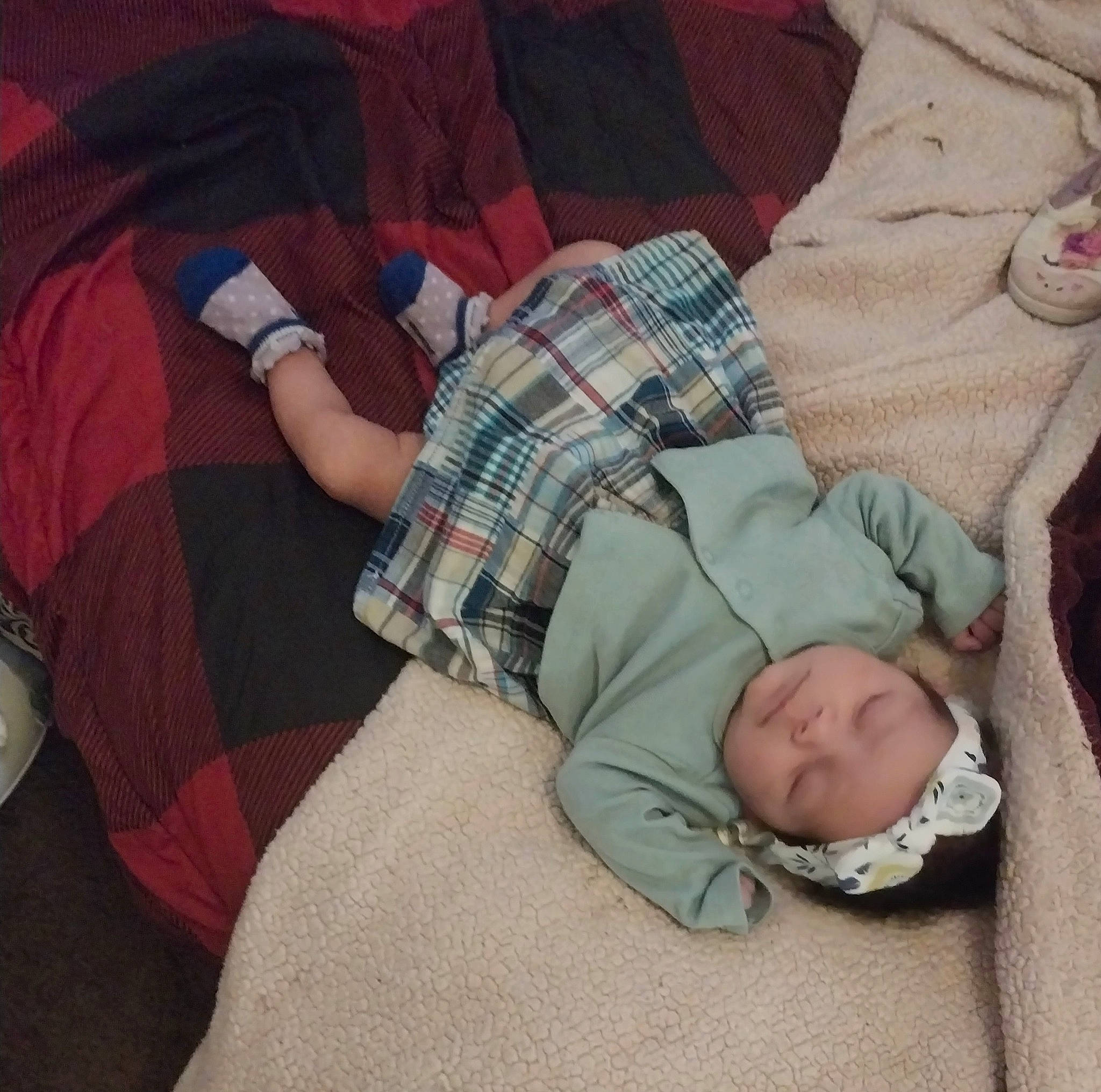 Delilah joined the competition — help win amazing prizes! baby, baby_products, baby_toddler_clothing, bedtime, carmine, child, comfort, headwear, human_leg, lap, linens, nap, pattern, person, plaid, room, sitting, sleep, tartan, thigh