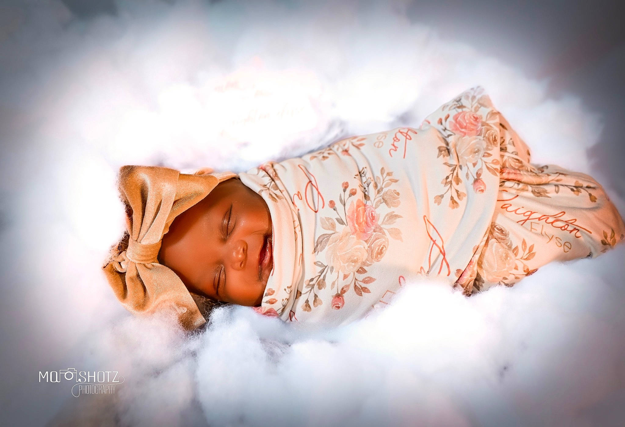 Paighton is registered to the contest to win money with this photo: baby, bedtime, child, cloud, comfort, dress, fashion_accessory, flash_photography, flesh, fur, happy, headgear, headpiece, headwear, human_body, linens, lip, peach, person, room