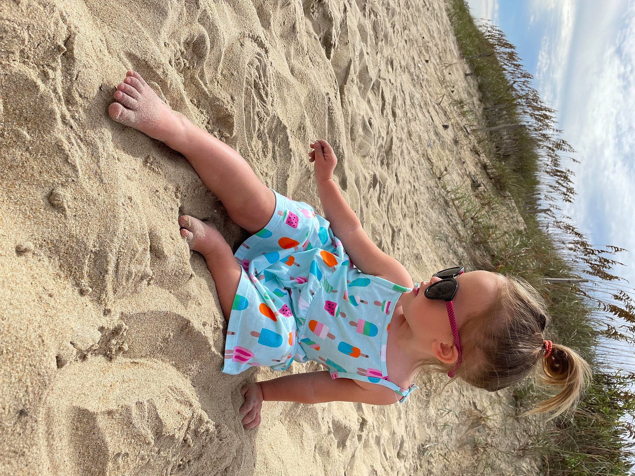 Abigail is registered to the contest to win money with this photo: beach, beauty, fun, grass, hair, happy, human_leg, knee, landscape, leg, leisure, nature, outdoor_recreation, people_in_nature, person, recreation, sky, summer, thigh, travel