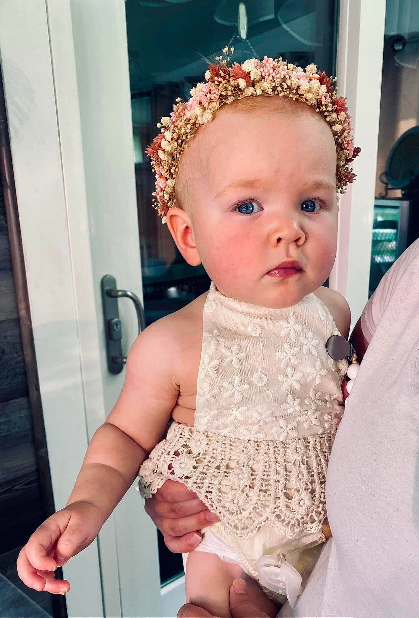 Charley is registered to the contest to win money with this photo: baby, baby_toddler_clothing, bridal_accessory, chair, child, dress, embellishment, event, fashion_accessory, happy, hat, headband, headpiece, iris, jewellery, necklace, person, pink, skin, toddler