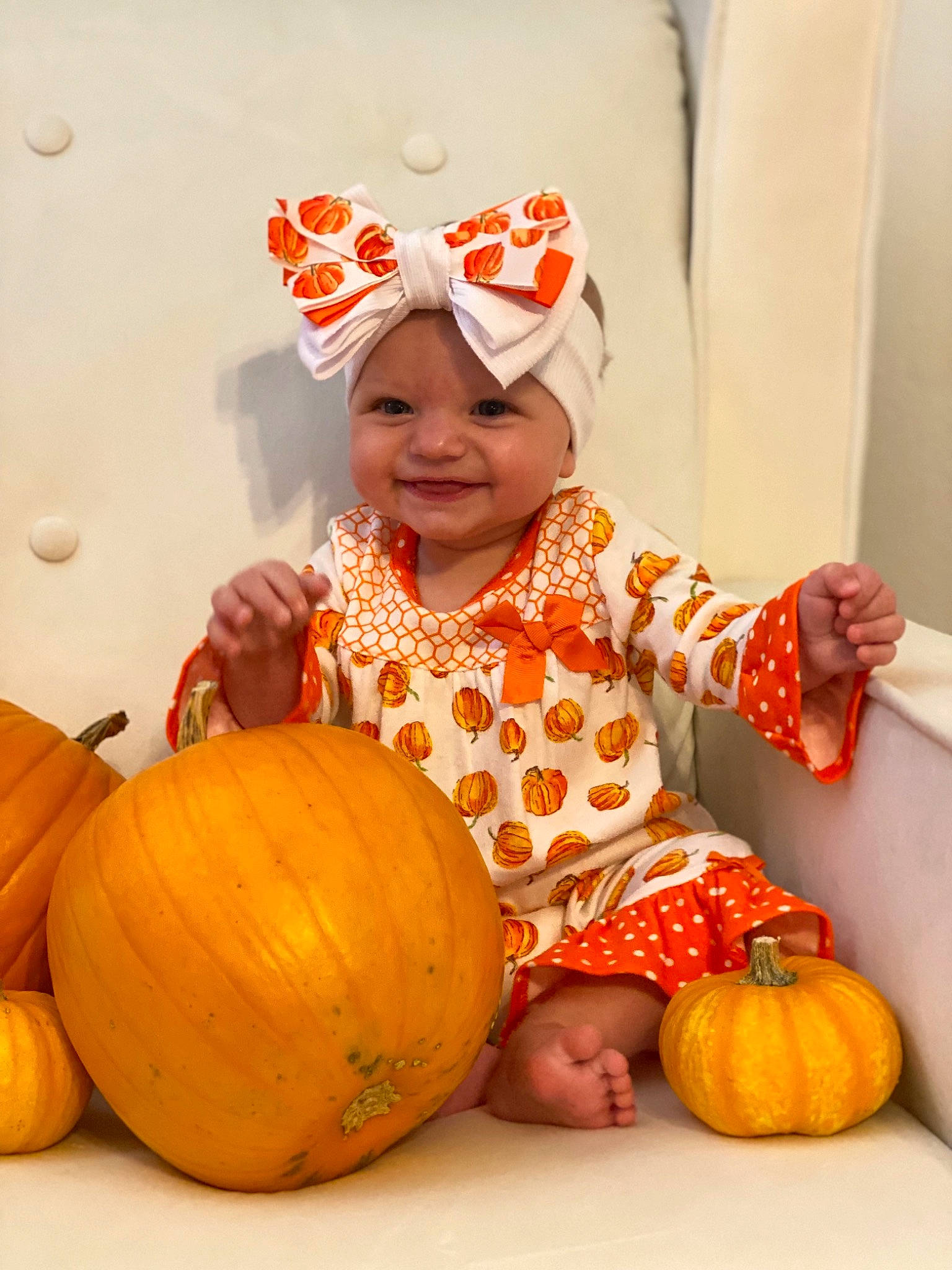 Emory is registered to the contest to win money with this photo: calabaza, eye, facial_expression, gourd, happy, head, headwear, human_body, joy, leaf, natural_foods, orange, organ, person, photograph, plant, pumpkin, shorts, smile, squash
