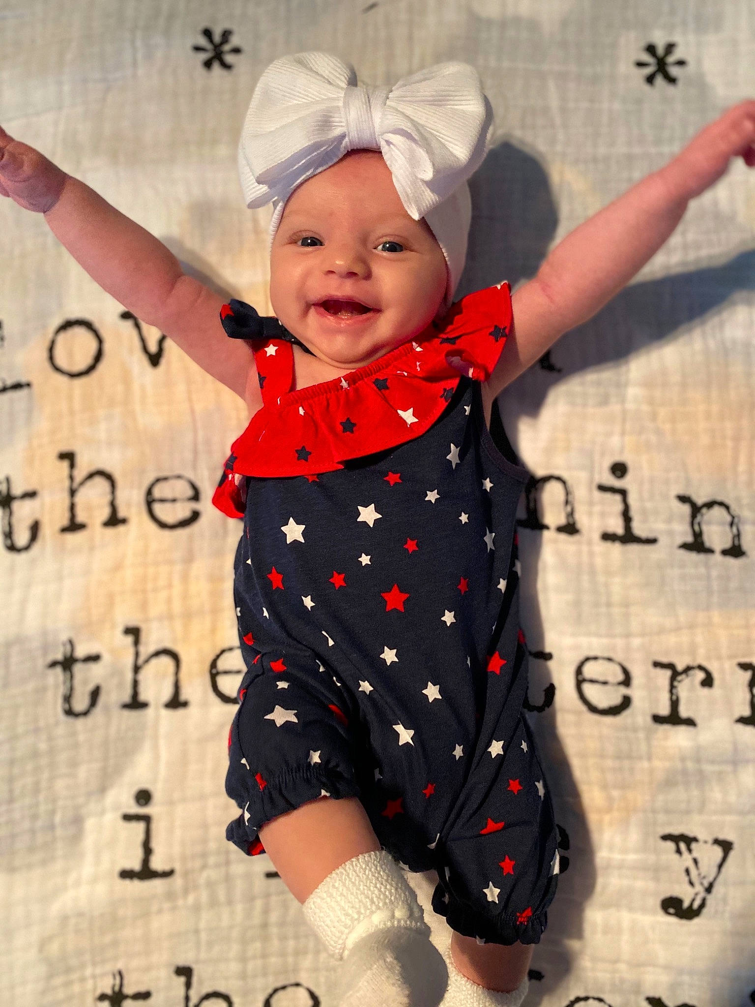 Emory joined the competition — help win amazing prizes! baby, baby_toddler_clothing, child, entertainment, finger, font, gesture, happy, headwear, pattern, performing_arts, person, photograph, pink, sleeve, smile, snapshot, t_shirt, textile, thumb