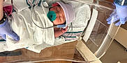 Kimberley joined the competition — help win amazing prizes! baby, bassinet, bed, blanket, cute, gloves, hat, healthcare, hospital, hospital_room, infant, medical_equipment, monitor, newborn, pacifier, peaceful, person, sleeping, swaddled, wooden_floor