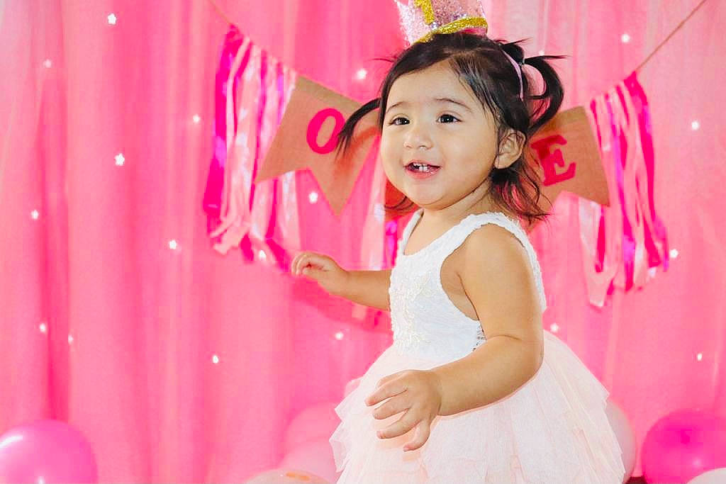Grace joined the competition — help win amazing prizes! baby_toddler_clothing, beauty, child, decoration, dress, event, flash_photography, fun, happy, headpiece, joy, magenta, one_piece_garment, party, peach, person, pink, room, skin, smile