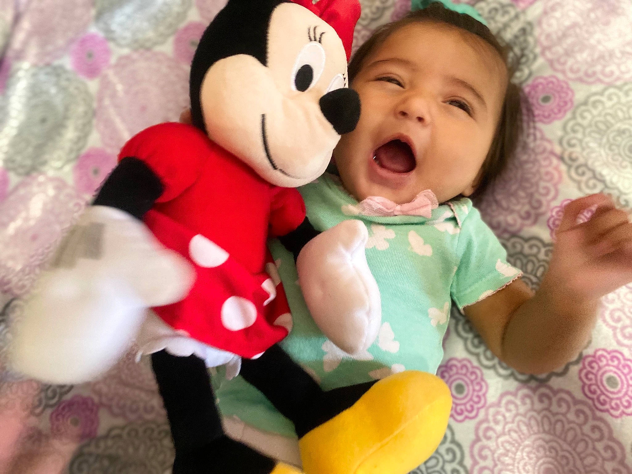 Grace is registered to the contest to win money with this photo: baby, baby_products, baby_toddler_clothing, carmine, cheek, child, comfort, facial_expression, finger, fun, gesture, happy, head, nose, person, pink, skin, smile, stuffed_toy, toddler
