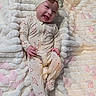 baby, infant, smiling, headband, onesie, hearts, blanket, plush, pink_petals, cute, happy, lying_down, soft_texture, indoors, child, apparel, adorable, infant_clothing, portrait, baby_girl