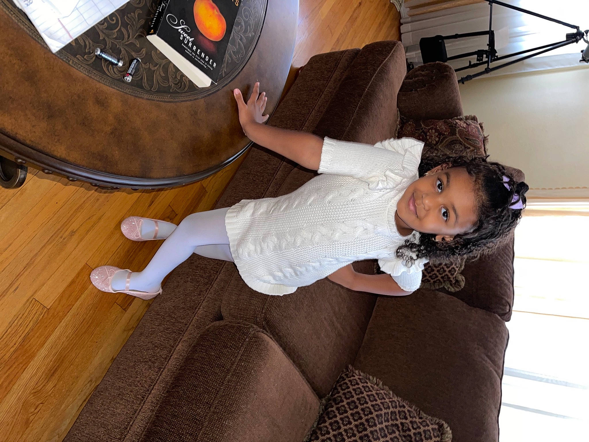 Khari is registered to the contest to win money with this photo: bedroom, comfort, couch, floor, flooring, foot, hardwood, human_leg, interior_design, joy, laminate_flooring, lamp, light_fixture, lighting, living_room, person, room, sock, varnish, wood_flooring