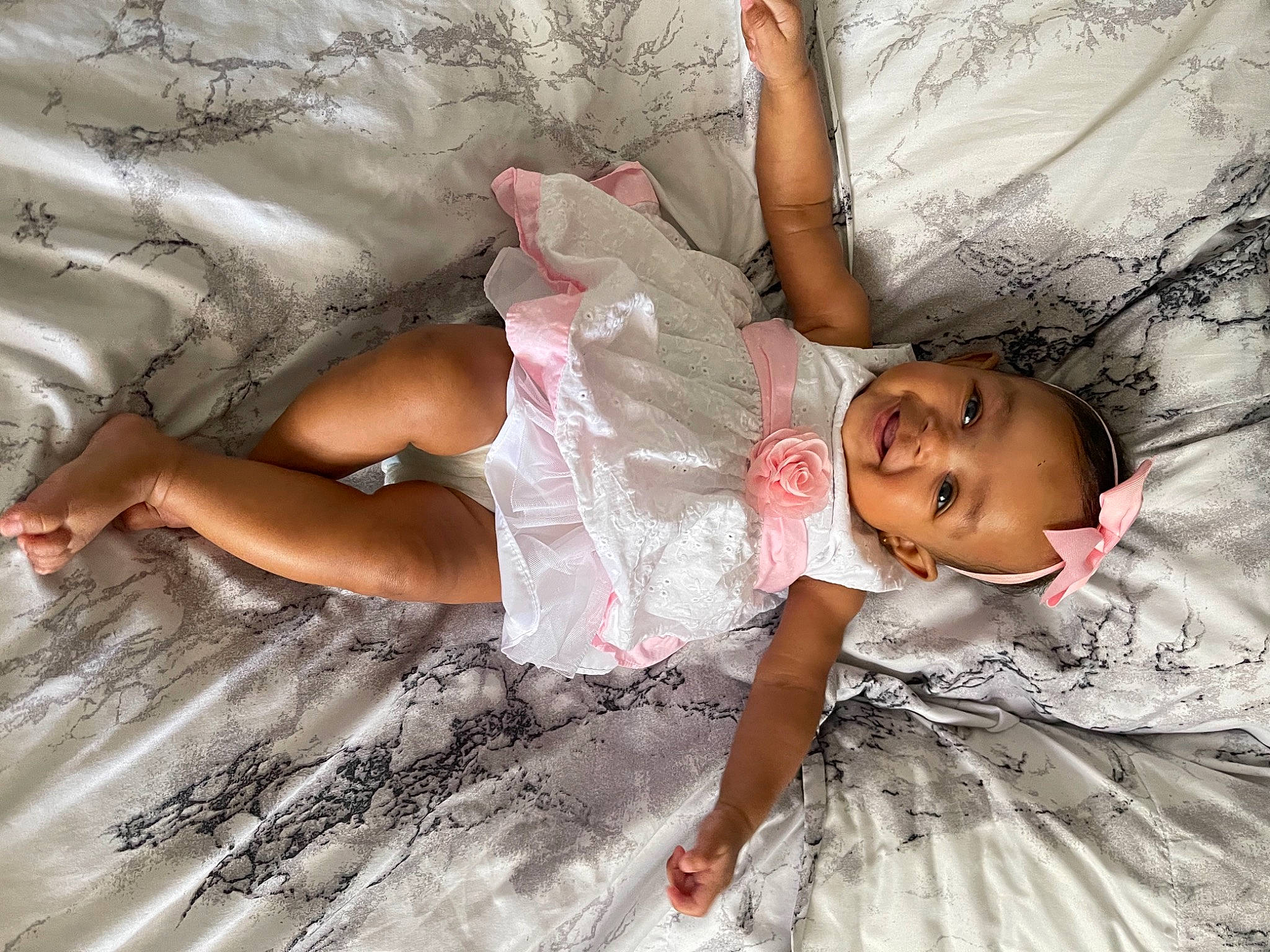 Khapri is registered to the contest to win money with this photo: ankle, arm, baby, baby_toddler_clothing, barefoot, child, comfort, foot, hand, human_body, joy, linens, person, pink, skin, stomach, textile, toddler, toe