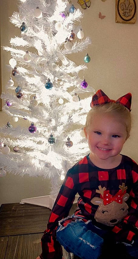 Lillian joined the competition — help win amazing prizes! baby_toddler_clothing, beauty, christmas, christmas_decoration, christmas_ornament, christmas_tree, event, fun, happy, holiday, holiday_ornament, joy, magenta, ornament, person, pink, sleeve, smile, t_shirt, toddler