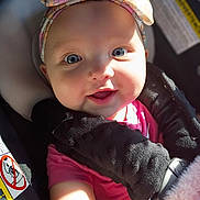 Hadley joined the competition — help win amazing prizes! baby, infant, child, car_seat, headband, floral, smiling, face, blue_eyes, sunlight, blanket, pink_shirt, clothing, seatbelt, safety, portrait, cute, happy, closeup, indoors