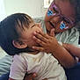 Avery Mae Zuniga is registered to the contest to win money with this photo: affection, baby, bed, child, cute, face, family, glasses, hair, hand, holding, indoor, person, playing, sitting, skin, smile, toddler, white_clothing, window