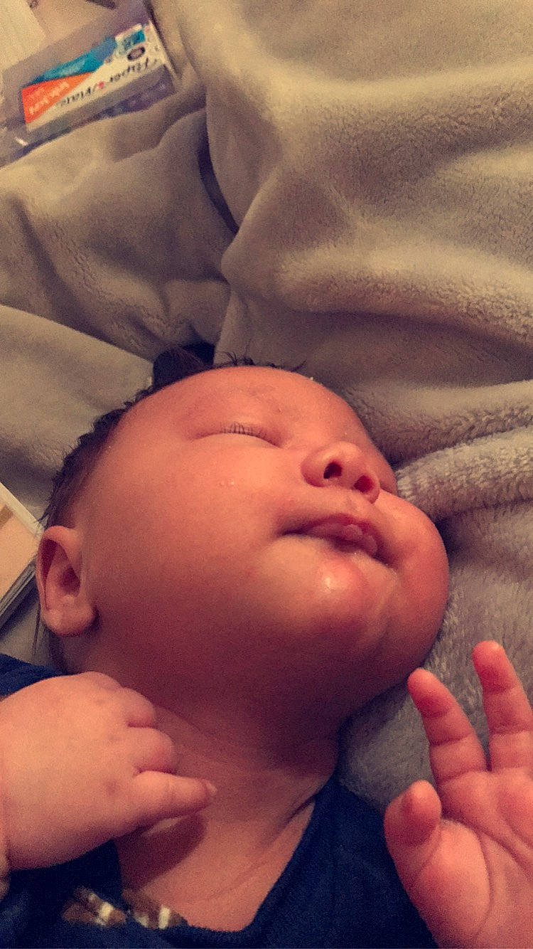 Jaxsun is registered to the contest to win money with this photo: baby, baby_toddler_clothing, cheek, child, chin, close_up, comfort, eyebrow, facial_expression, finger, flesh, forehead, gesture, headwear, human, lip, nail, organ, person, skin