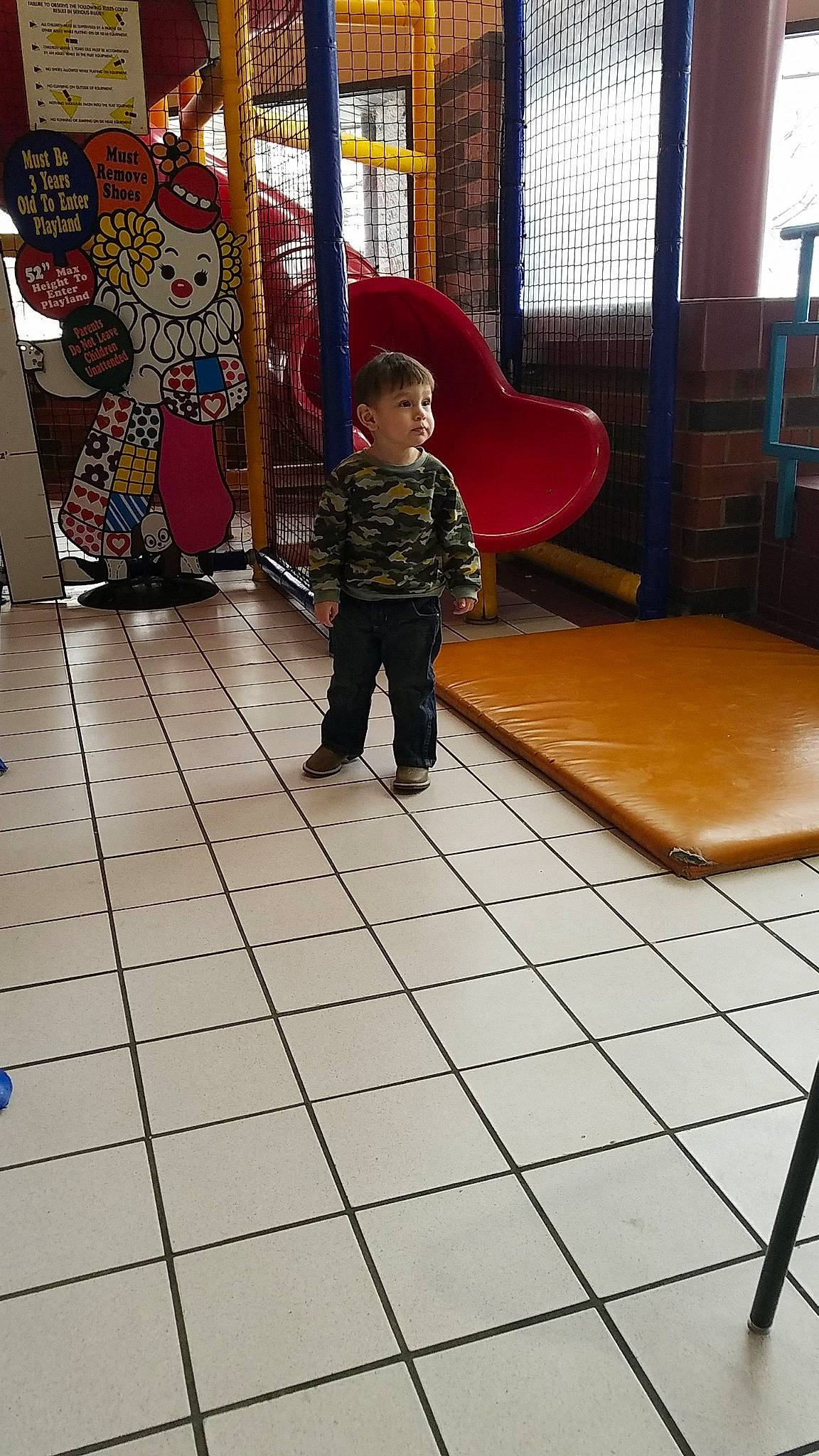 Liem is registered to the contest to win money with this photo: carpet, child, cobblestone, concrete, floor, flooring, fun, hardwood, leisure, pattern, person, play, playground, recreation, road_surface, room, tile, toddler, visual_arts, window