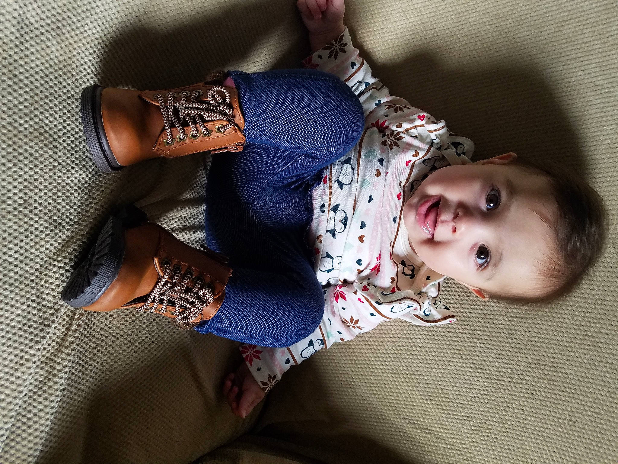 Shania is registered to the contest to win money with this photo: baby, comfort, cool, elbow, flash_photography, foot, human_body, human_leg, joint, knee, pattern, person, plaid, sitting, skin, sleeve, textile, thigh, toddler, waist