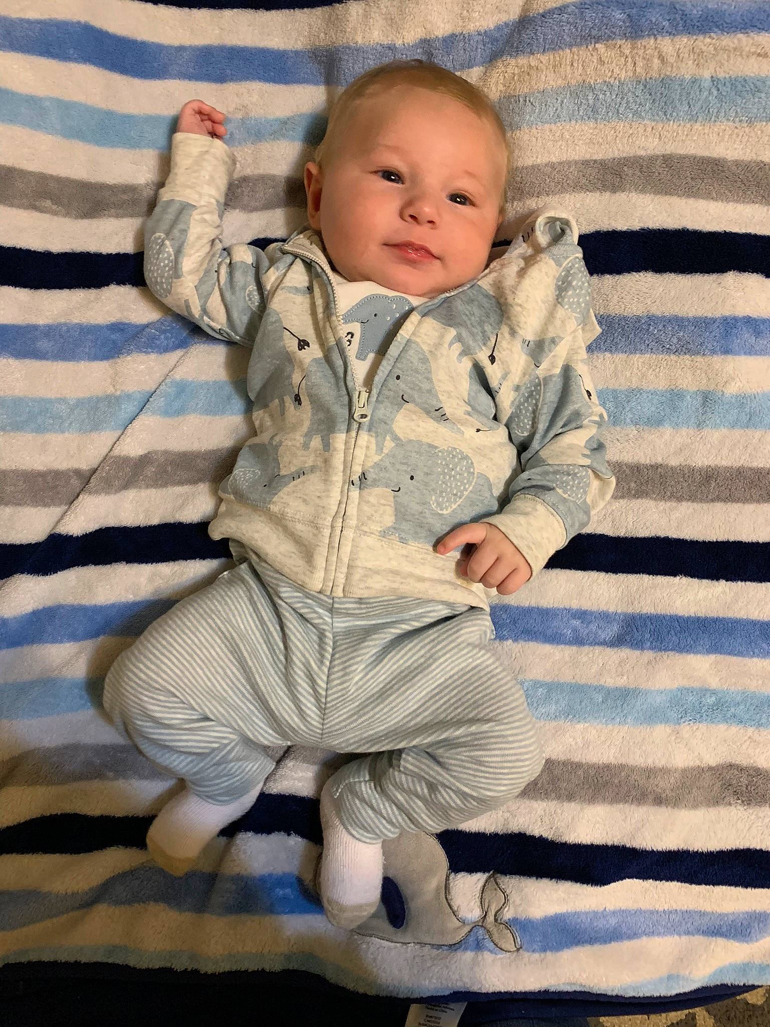 Ezra joined the competition — help win amazing prizes! baby, baby_toddler_clothing, barefoot, cheek, comfort, electric_blue, eye, face, flooring, foot, happy, head, linens, outerwear, pattern, person, sitting, sleeve, smile, toddler