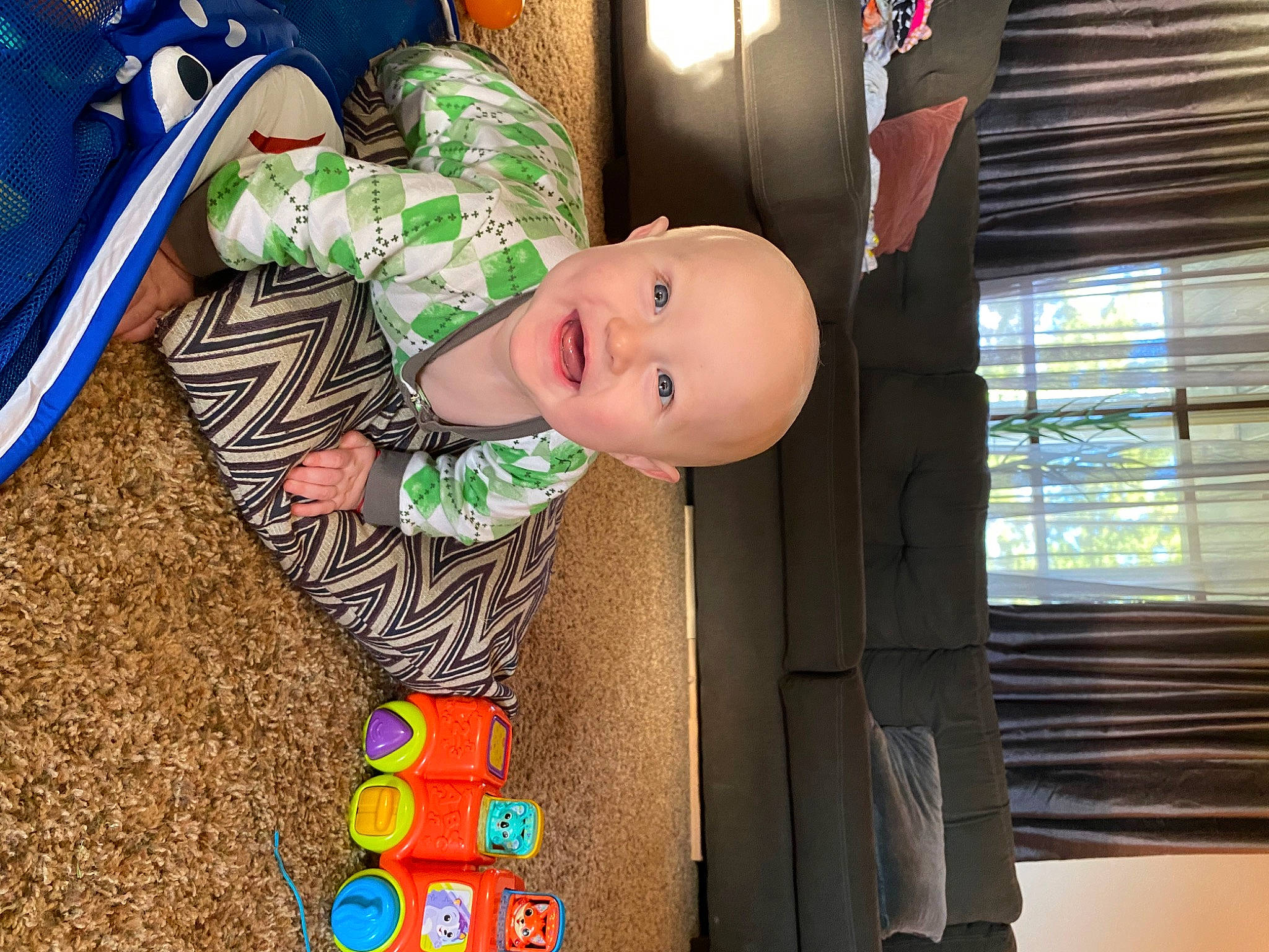 Bobby joined the competition — help win amazing prizes! baby, baby_laughing, baby_products, baby_toddler_clothing, baby_toys, child, fun, happy, hat, leisure, person, play, room, smile, toddler, window, window_blind, wood