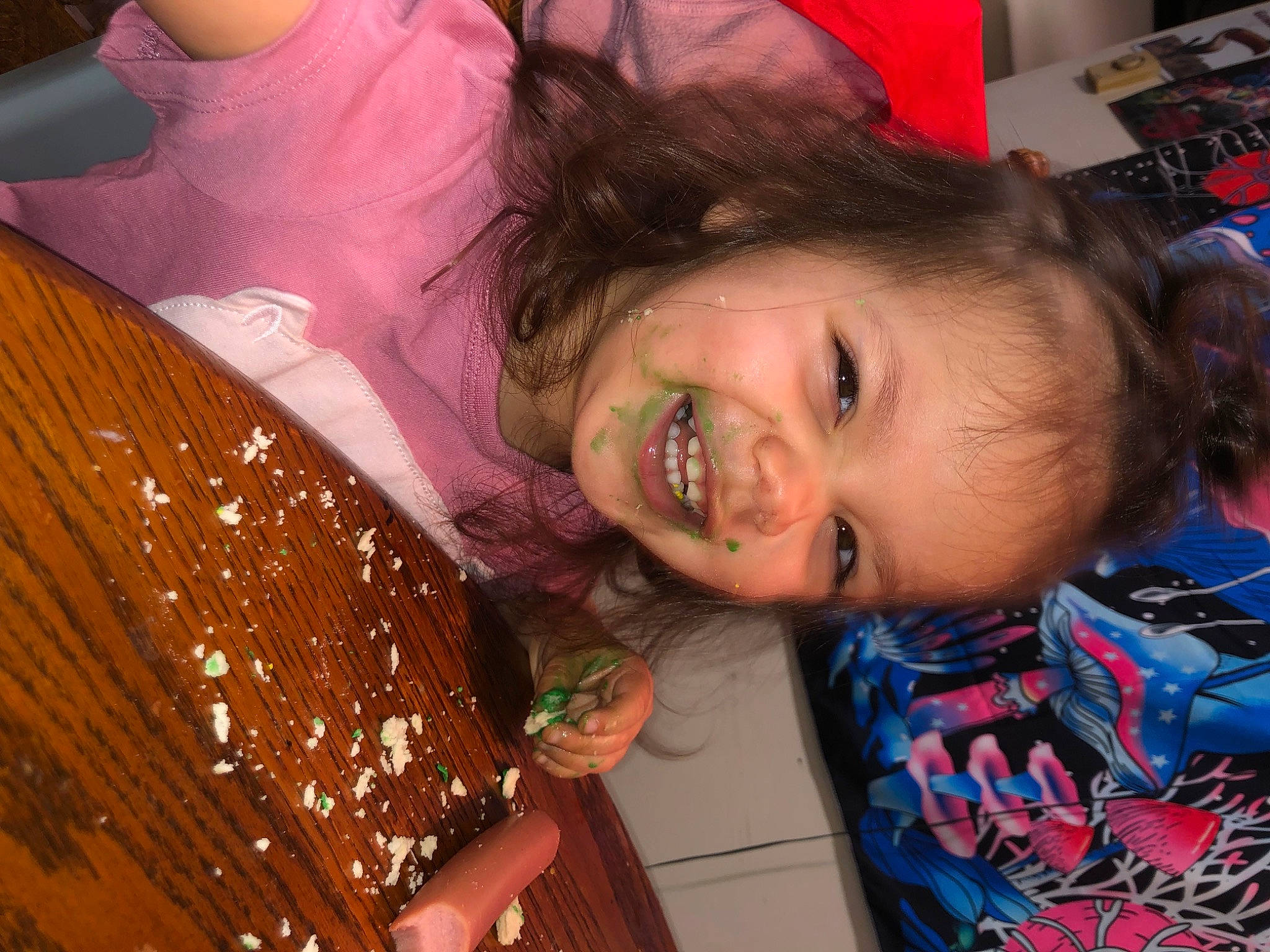 Ava is registered to the contest to win money with this photo: brown_hair, cheek, child, ear, event, eyelash, fun, happy, iris, joy, long_hair, mouth, nose, pattern, person, room, skin, smile, textile, toddler