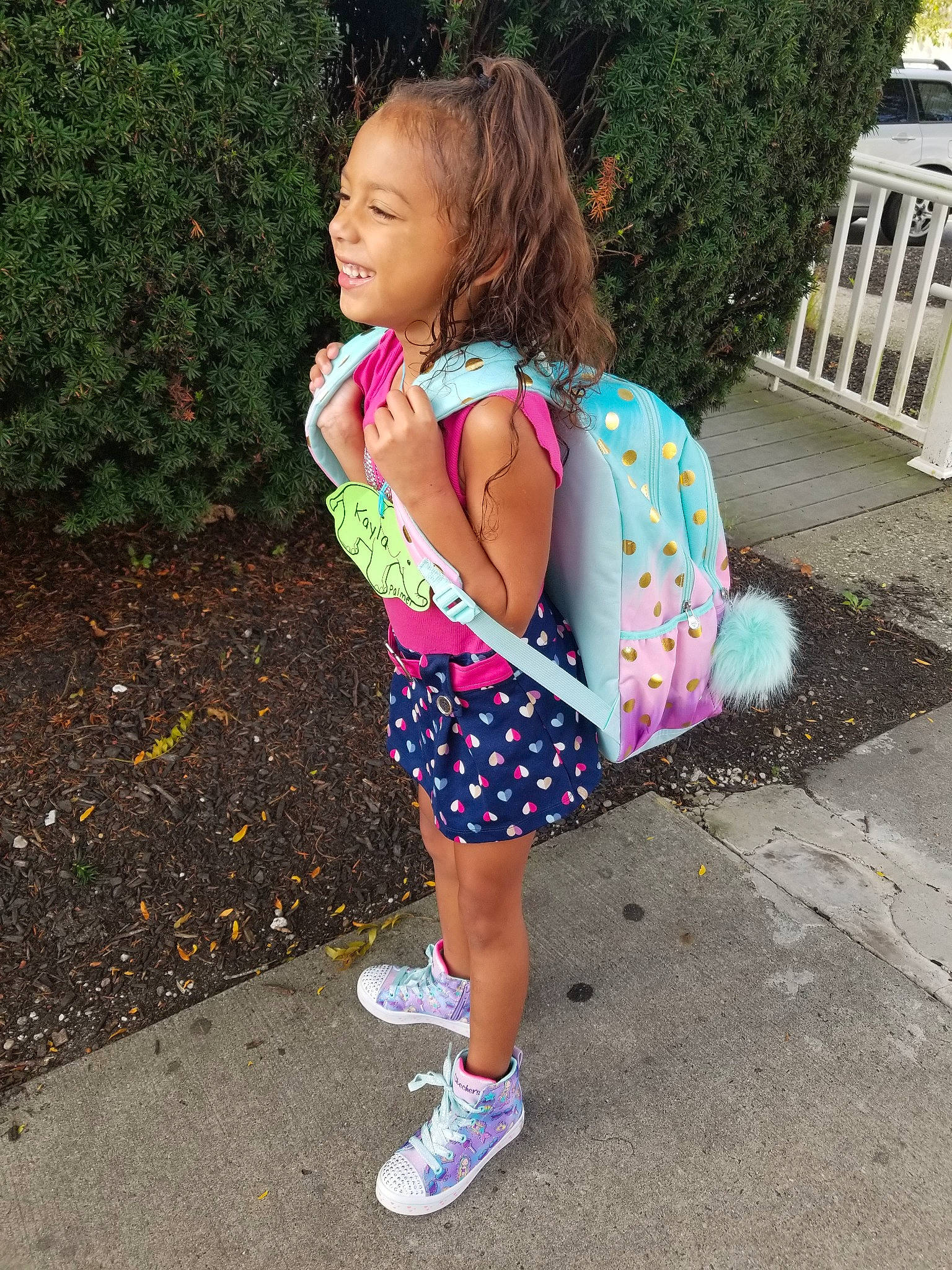 Kayla is registered to the contest to win money with this photo: child, design, dress, fashion, fashion_accessory, footwear, joy, pattern, person, pink, plant, play, recreation, shoe, shoulder, street_fashion, summer, t_shirt, toddler, vacation