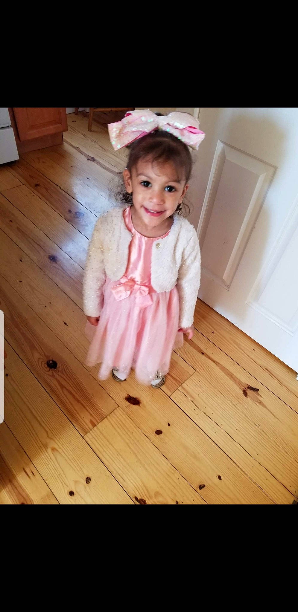 Kacie joined the competition — help win amazing prizes! baby, baby_toddler_clothing, child, child_model, clothing, dress, floor, flooring, hair_accessory, headgear, joy, leg, outerwear, person, pink, product, sitting, skin, sleeve, textile