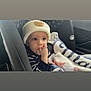 Mateo joined the competition — help win amazing prizes! baby, blanket, car, car_interior, car_seat, child, comfort, cute, hand_in_mouth, hat, indoors, infant, knit_hat, portrait, seat, seatbelt, striped_clothing, thoughtful, warm_clothing, young_child