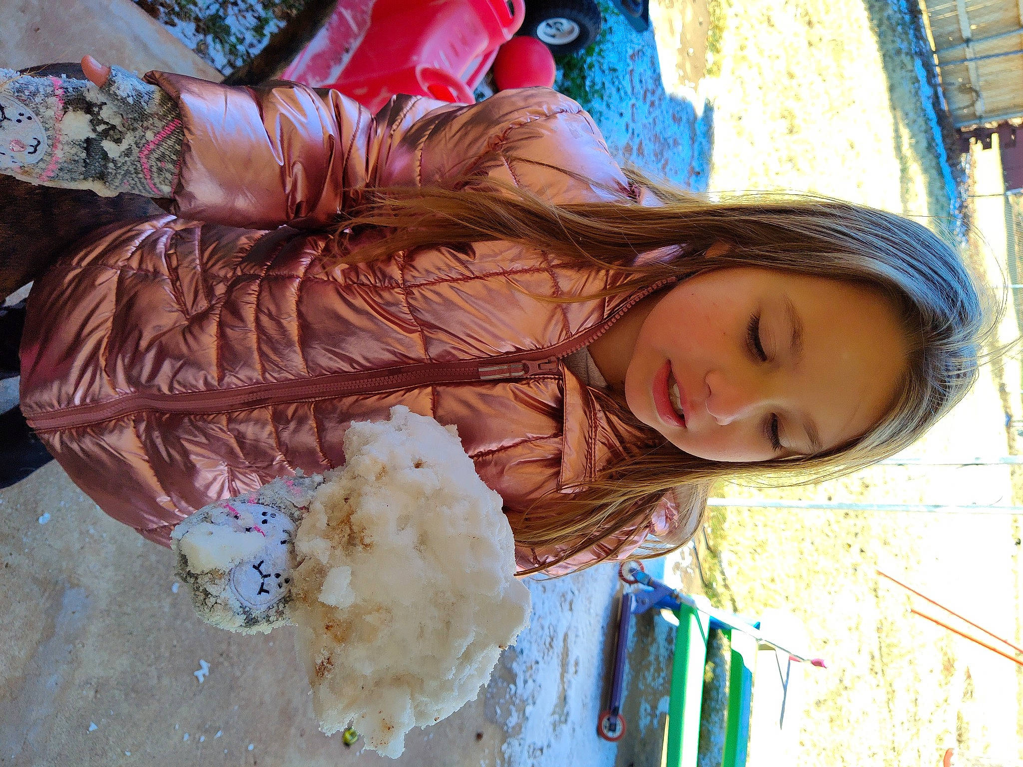 Lacie is registered to the contest to win money with this photo: blue, brown_hair, child, costume, electric_blue, facial_expression, fashion_accessory, freezing, fun, fur, glove, hair_coloring, hairstyle, human_leg, long_hair, person, pink, plastic_bag, tree, window