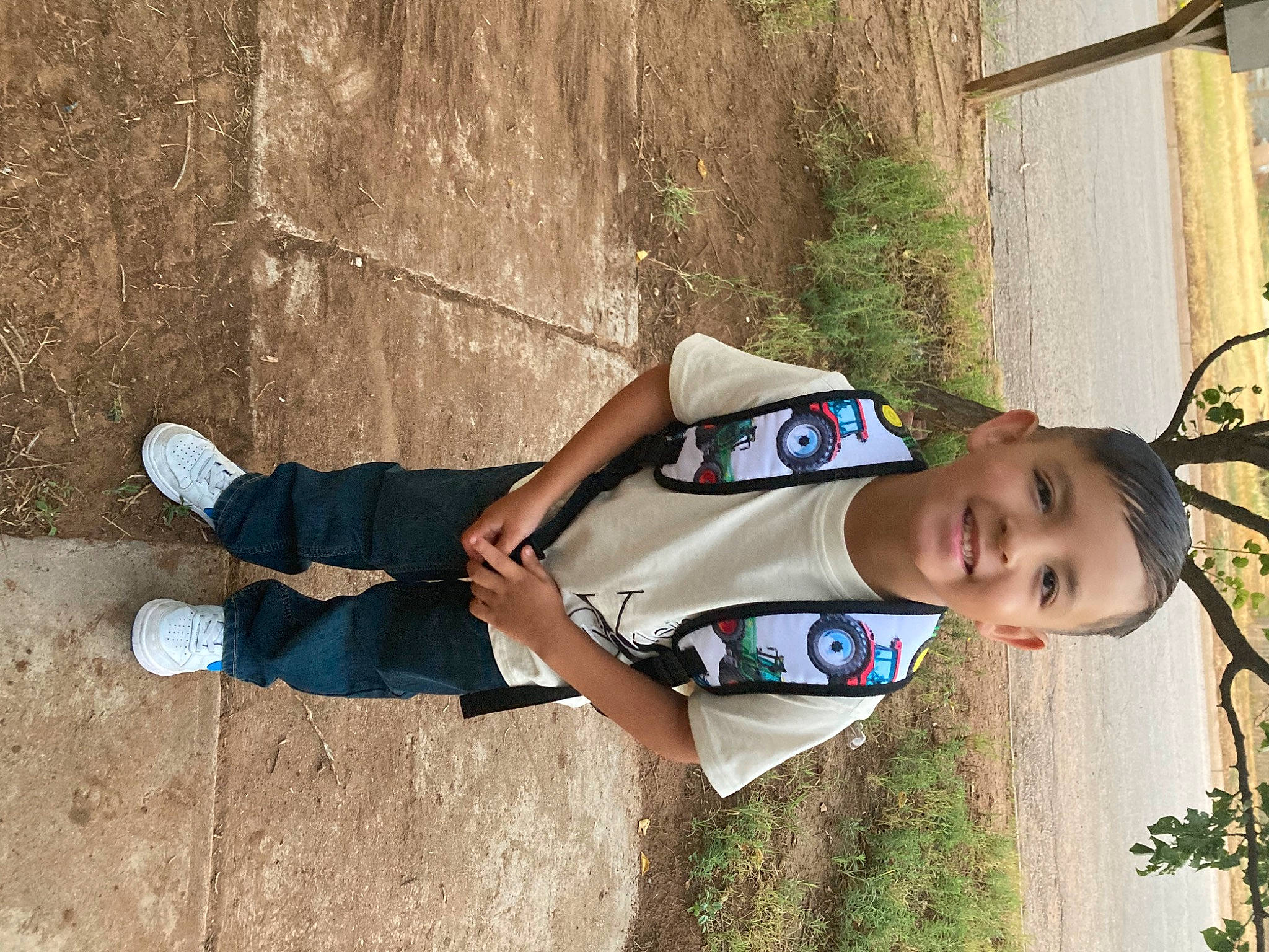 Josiah is registered to the contest to win money with this photo: child, elbow, fun, grass, happy, human_leg, joint, joy, knee, leisure, people_in_nature, person, plant, recreation, shadow, soil, t_shirt, thigh, toddler, tree