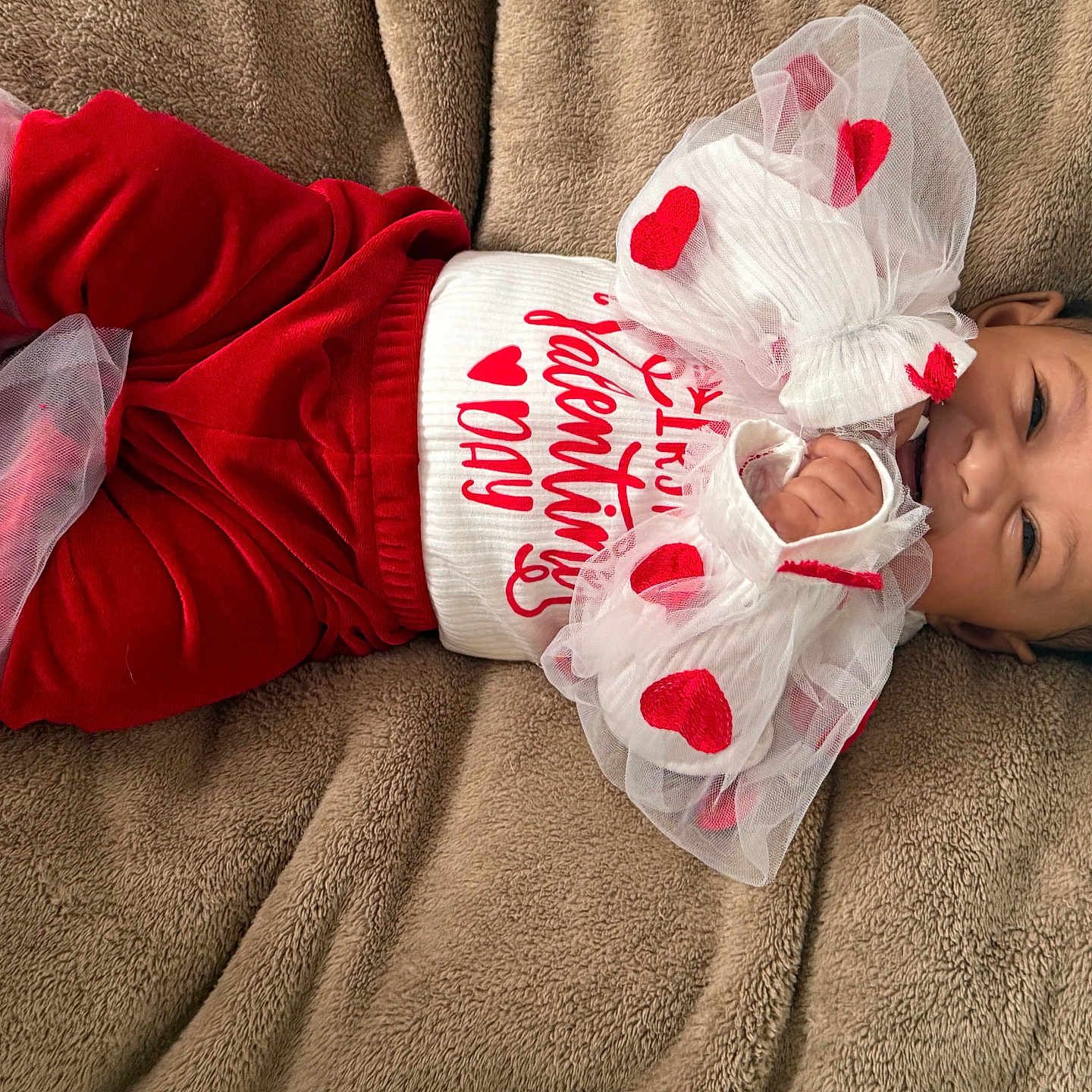 Jannie joined the competition — help win amazing prizes! baby, blanket, celebration, child, cozy, cute, fabric, festive, happy, hearts, holiday, infant, lying_down, portrait, red_clothing, smiling, toddler, tulle, valentines_day, white_clothing