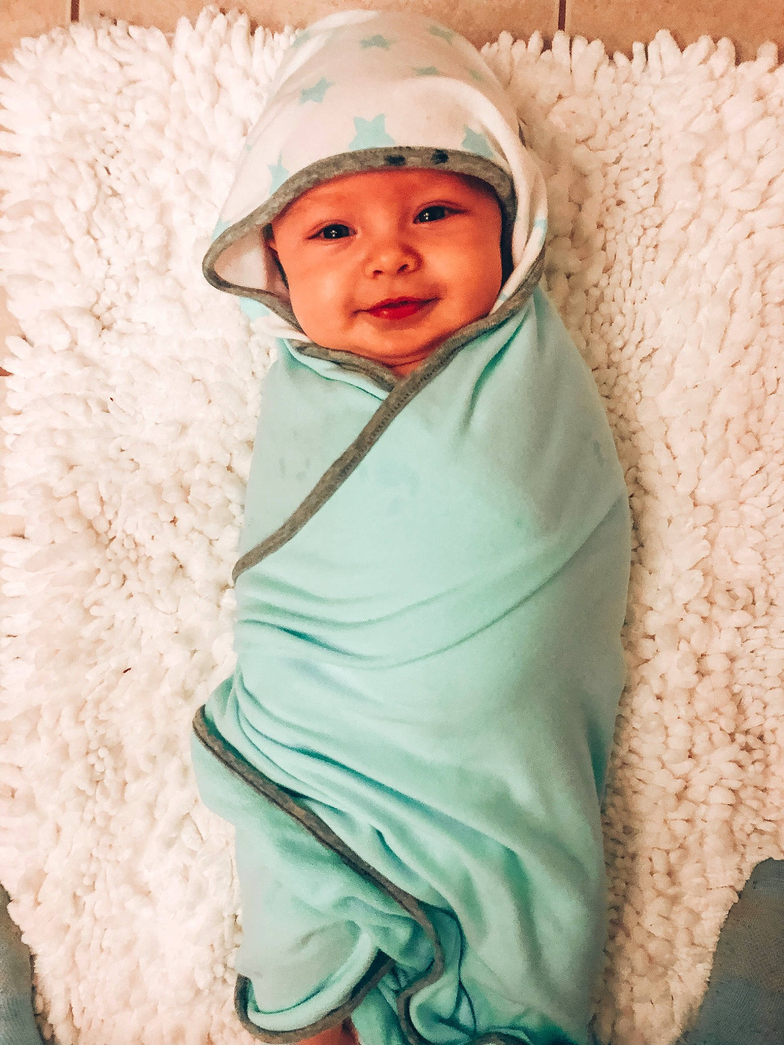 Braxton joined the competition — help win amazing prizes! baby, baby_products, baby_toddler_clothing, beanie, cap, cheek, child, comfort, eye, fashion_accessory, fur, happy, headwear, human, linens, outerwear, person, sitting, sleeve, smile