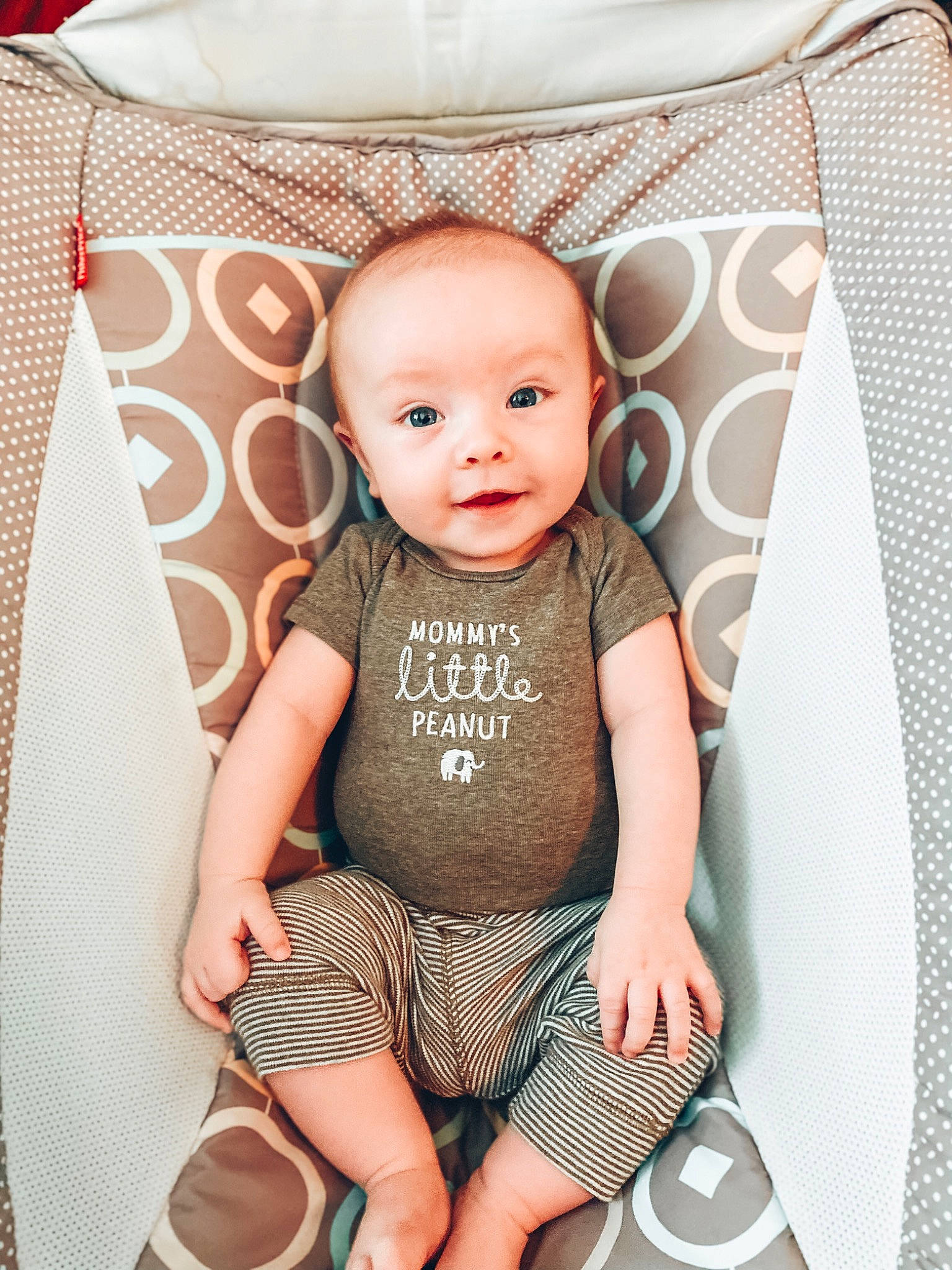 Braxton is registered to the contest to win money with this photo: baby, baby_toddler_clothing, chair, cheek, clothing, eye, face, happy, head, iris, neck, pattern, person, pink, skin, sleeve, t_shirt, textile, thigh, toddler