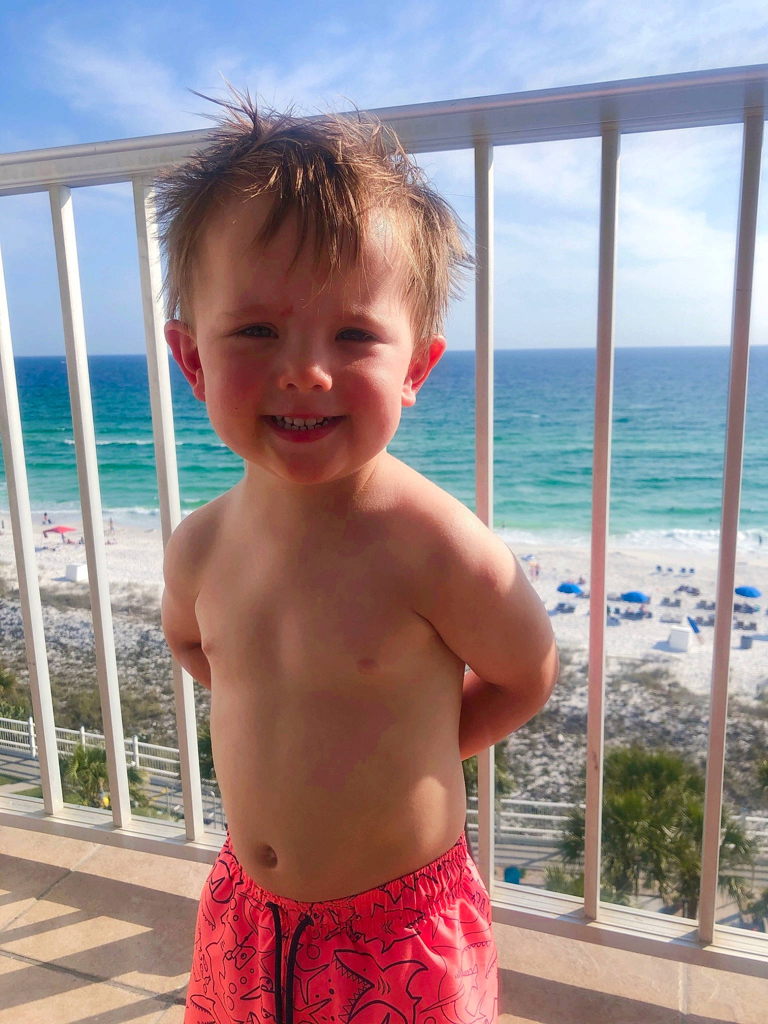 Easton is registered to the contest to win money with this photo: azure, beach, chin, cloud, eye, fun, hairstyle, happy, head, human_body, joy, leisure, light, people_on_beach, person, plant, sky, smile, summer, travel