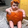 Amina is registered to the contest to win money with this photo: baby, pumpkin, headband, orange, kitchen, counter, infant, cute, child, indoors, portrait, sitting, chubby, skin, feet, hand, face, expression, holiday, autumn