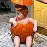 Amina is registered to the contest to win money with this photo: baby, pumpkin, headband, kitchen, countertop, orange, infant, hand, costume, cute, chubby, sitting, indoor, decor, seasonal, fall, holiday, adorable, child, portrait
