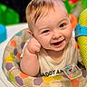 baby, smile, face, child, infant, seat, colorful, toy, happy, cute, person, clothing, pattern, hexagon, play, indoors, expression, cheerful, closeup, skin