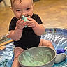 baby, child, sitting, toy, slime, bowl, socks, floor, indoor, play, water, foam, smile, happy, cute, skin, hands, face, blue_toy, playtime