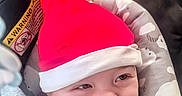 Niko joined the competition — help win amazing prizes! baby, smile, santa_hat, red_hat, car_seat, blanket, cozy, cute, child, infant, happy, face, clothing, seatbelt, headwear, indoors, portrait, holiday, expression, toddler