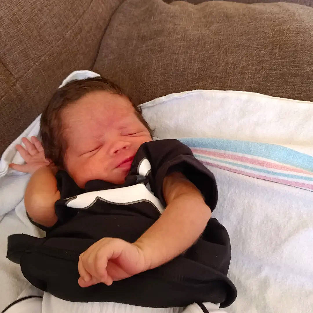 Egypt is registered to the contest to win money with this photo: baby, baby_products, baby_sleeping, baby_toddler_clothing, bedding, cheek, child, comfort, elbow, knee, lap, linens, nap, pattern, person, room, sitting, sleeve, thigh, thumb