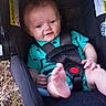 Valerian joined the competition — help win amazing prizes! baby, car_seat, child, infant, foot, teal_clothing, outdoor, grass, seatbelt, playful, candid, smiling, young_child, safety_harness, person, cute, small_child, seat, baby_toddler, casual